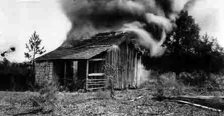 A burning cabin near Rosewood, FL, January 4, 1923.